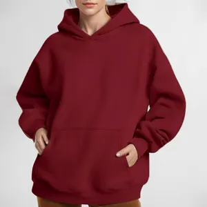 Solid burgundy oversized hooded sweatshirt for women featuring a cozy kangaroo pocket