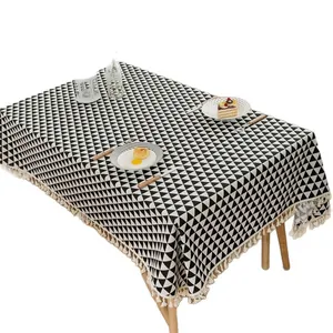 Mantel de lino moderno con estampado geométrico y borlas decorativas para el comedor