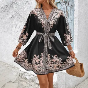 Elegant black summer mini dress with boho floral print, balloon sleeves and waist tie
