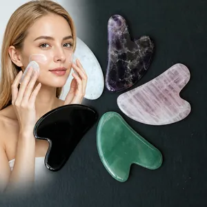 Natural jade heart-shaped Gua Sha tool for facial and body massage revitalizing skin