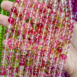 Close-up macro of vibrant pink and green watermelon style crystal beads for DIY jewelry making