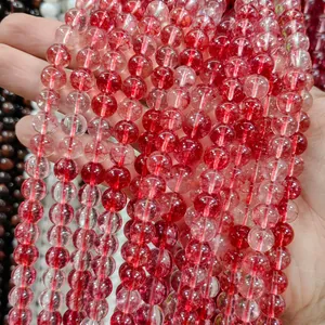 Macro detail of red strawberry crystal glass beads for DIY handmade jewelry crafting.