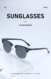 Detail view of trendy half-frame sunglasses with classic metal rivets and gold finish.