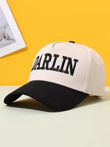 Detailed view of cream and black color-block trucker hat with DARLIN embroidery.