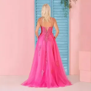 Detailed back view of hot pink lace-up evening gown with delicate floral lace