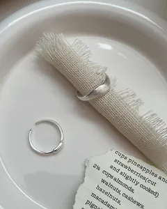 S925 sterling silver wavy ring detail with brushed texture and minimalist design