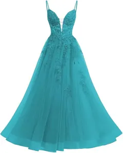 Detail of teal tulle prom dress with lace appliqués and deep V-neckline spaghetti straps