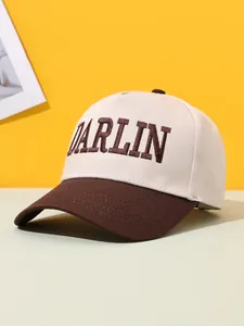 Detailed view of vintage two-tone baseball cap featuring brown DARLIN embroidery.