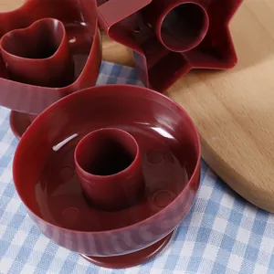 Red plastic donut molds set in heart, star, and round shapes for DIY baking projects