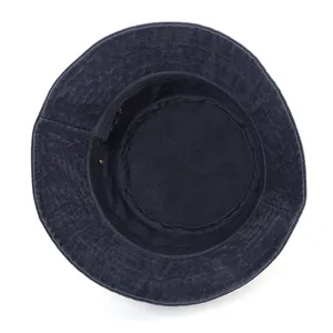 Inside view of navy blue cotton bucket hat showing stitching detail and eyelets