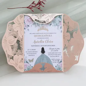 Detailed macro view of an elegant laser-cut pink wedding invitation with intricate floral patterns