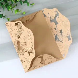 Detailed macro view of elegant gold laser-cut leaf pattern on wedding invitation card