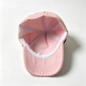 Detailed interior view of a soft plush pink baseball cap showing the quality inner lining