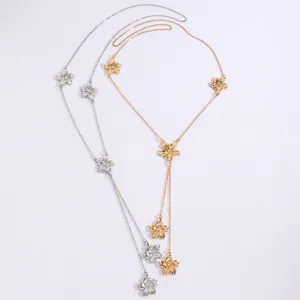 Detailed view of sweet floral lariat necklaces in gold and silver finishes