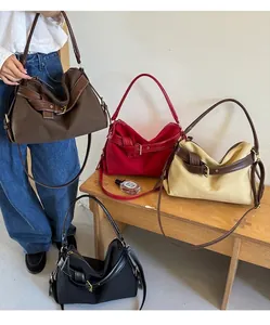 Close-up showing the four colors of the canvas and leather patchwork bags