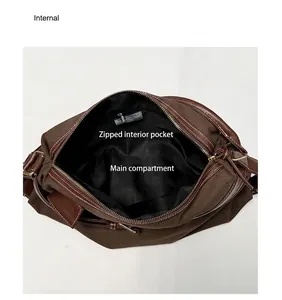 Detailed internal view of casual canvas shoulder bag showing main compartment and pocket