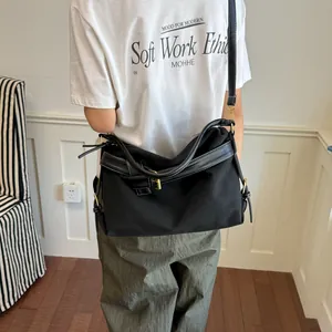 Modern minimalist black canvas crossbody bag for women, perfect for daily casual wear
