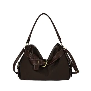 Fashionable dark brown canvas hobo shoulder bag with buckle detail and white stitching