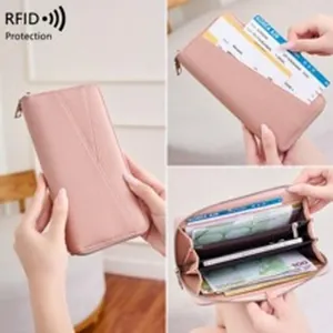 Close-up view showing the internal card slots and RFID protection of pink leather wallet