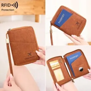 Detailed view of brown RFID leather wallet with multiple card slots and passport compartment