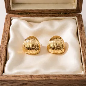 Elegant gold-plated stainless steel dome stud earrings with vertical textured ridges