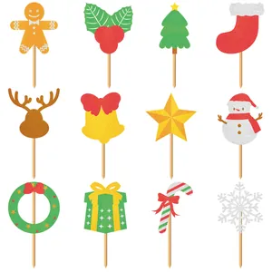 Detailed view of 12 glitter Christmas cake toppers with festive shapes and wood sticks