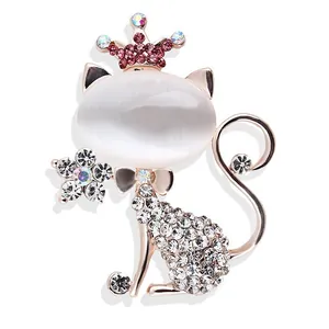 Elegant cute cat brooch featuring white opal and sparkling crystals in rose gold finish
