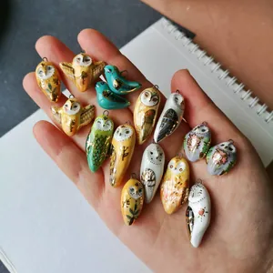 Handmade owl and bird pendants with colorful oil-painted details for DIY jewelry