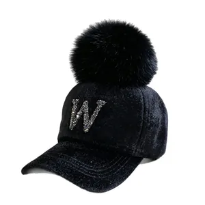 Stylish women's black faux mink baseball cap with rhinestone letter W and large pom-pom