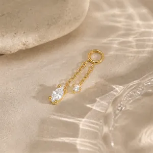 Detailed macro view of gold-plated sterling silver charm with marquise and round stones