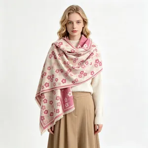 Detailed view of elegant pink magnolia flower pattern imitation cashmere shawl on model