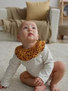 Premium soft cotton baby bib featuring stylish leopard print and decorative ruffle design