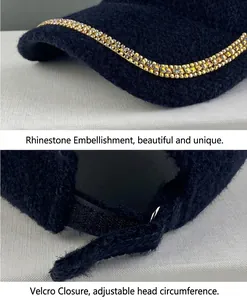 Close-up of the rhinestone-decorated brim and adjustable Velcro strap on a fuzzy black cap