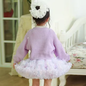 Back view of a fluffy multi-layer pastel tutu skirt for girls in a cozy setting