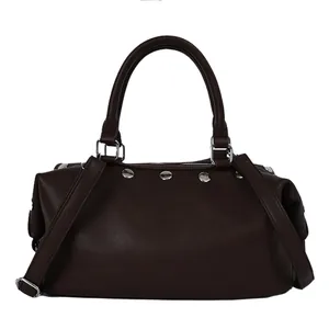 Vintage dark brown studded leather tote bag with top handle and crossbody strap