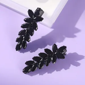Elegant black wheat ear leaf hair clips with zircon stones on purple background