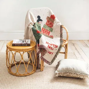 Cozy woven holiday throw blanket with festive Happy New Year illustration on rattan chair