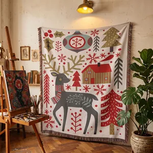 Detailed view of bohemian Christmas reindeer woven tapestry blanket hanging in cozy studio