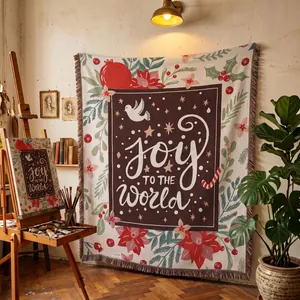 Cozy Joy to the World woven Christmas tapestry blanket in a warm artist studio