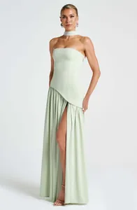 Detailed view of a mint green strapless dress with a high slit and matching choker.