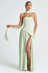 Elegant sage green strapless maxi dress featuring a high slit and matching neck scarf