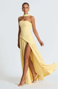 Elegant pale yellow strapless maxi dress featuring a high slit and matching neck choker.
