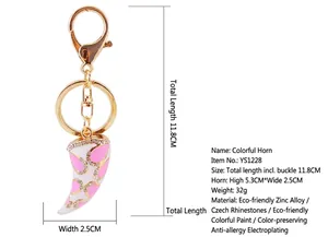 Detailed view of pink and white enamel horn keychain with rhinestones and lobster clasp