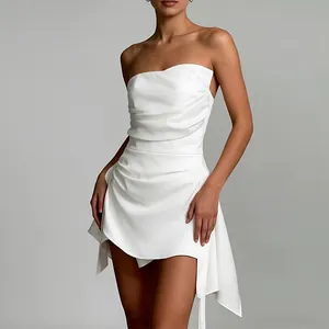 Close-up detail of white strapless French style dress with elegant draped pleats