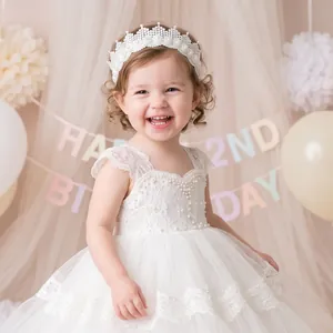 Detailed macro view of a sweet white lace crown headband with pearls for toddlers birthday