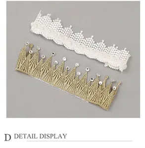 Detail view of sweet white and gold lace headbands with rhinestones and pearls.