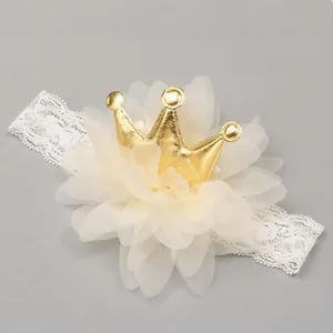 Detail shot of a sweet children's lace headband featuring mesh flower and gold crown