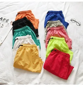 Detailed view of colorful quick-dry beach shorts in various vibrant candy colors.