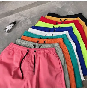 Multi-color quick-dry beach shorts display showing elastic waist and drawstrings.
