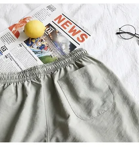Close-up of lightweight quick-dry shorts detail with back pocket and elastic waistband